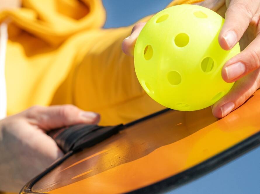 Girl Holding Pickleball paddle for Private Event